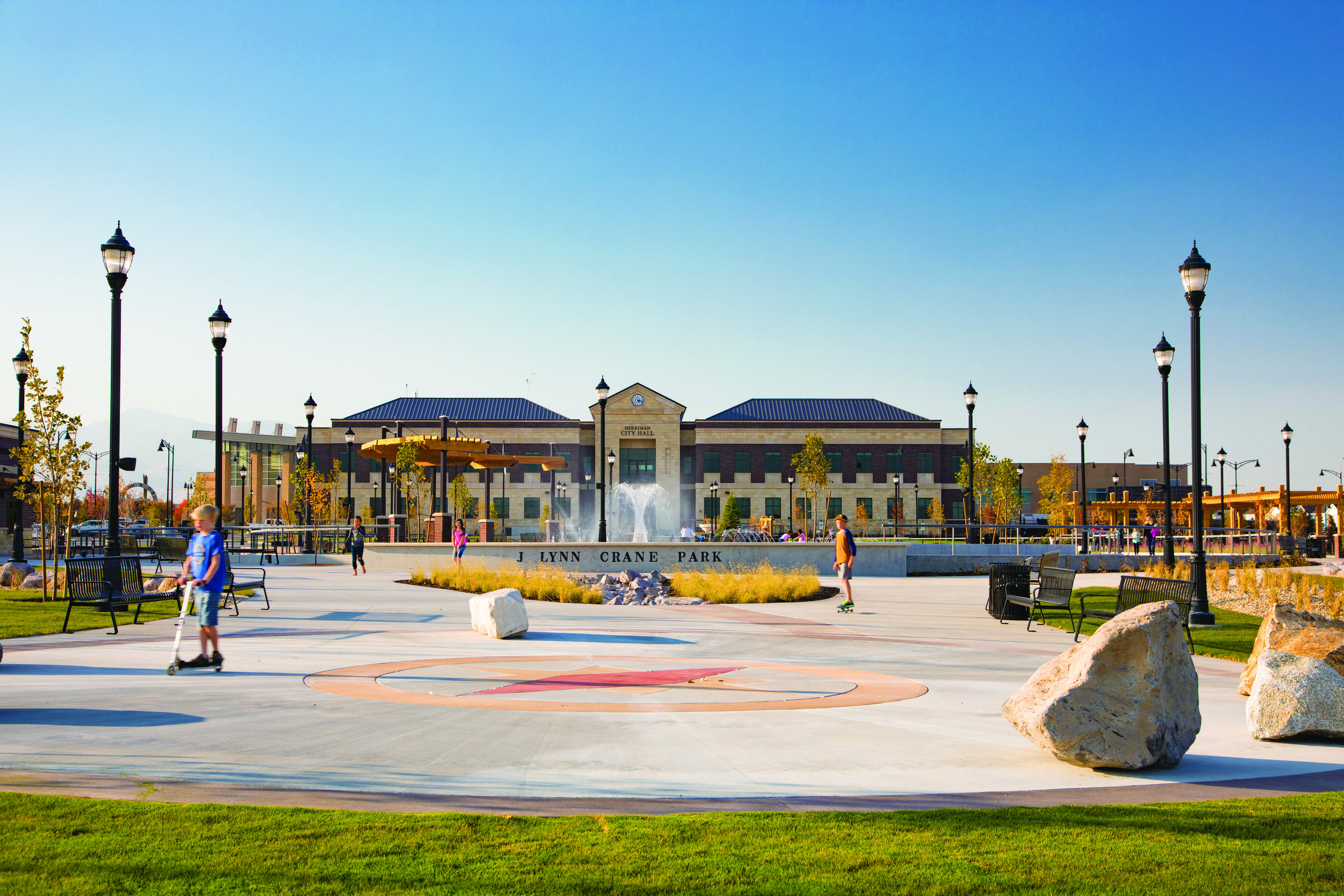  Centered between City Hall and the Band Stand, the Compass Plaza helps identify six major peaks visible from Herriman. Standing in the center and looking out, each boulder aligns with a peak. 