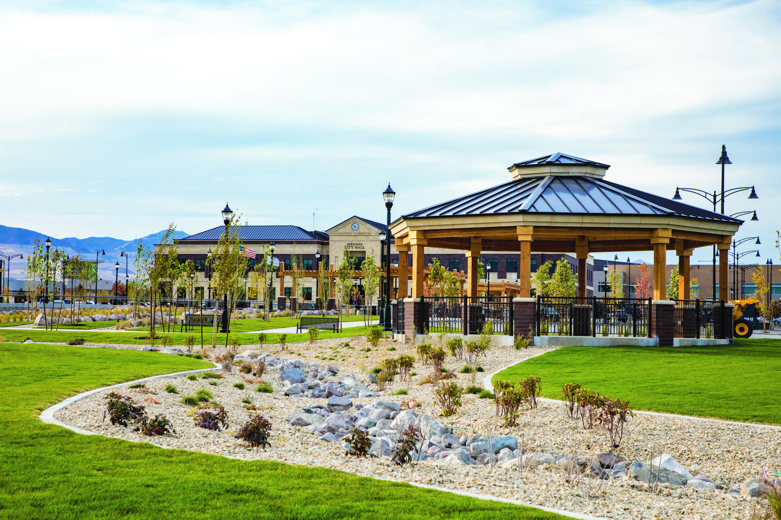  Beyond the Ice ribbon, the implied stream that traverses the Towne Center is represented by a dry steam bed adding variety and interest with texture and plants at the edge of the Amphitheater Lawn. 